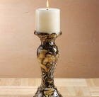 A fine addition to your jungle motif, this candle holder is done up in dazzling animal print safari patchwork. Porcelain. 3 5/8" diameter x 8 1/2" high.